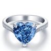 Heart Design Blue Topaz Engagement Ring in Rhodium Plated Sterling Silver