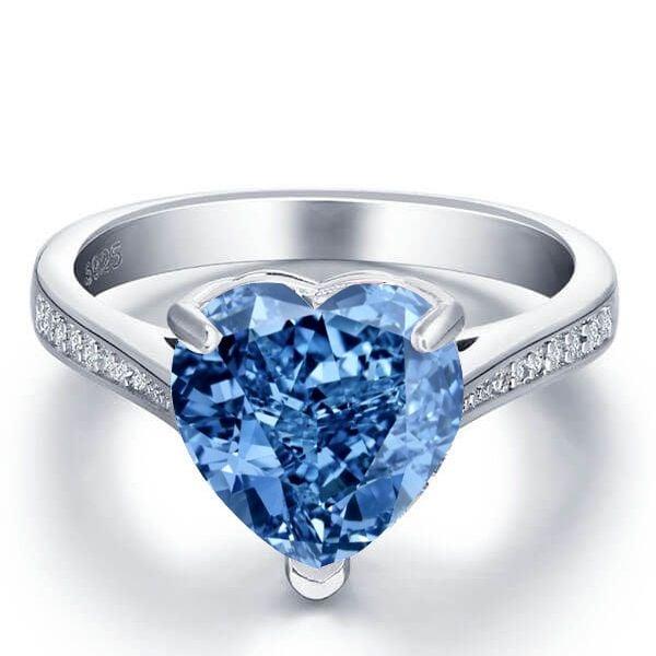 Heart Design Blue Topaz Engagement Ring in Rhodium Plated Sterling Silver