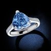 Heart Design Blue Topaz Engagement Ring in Rhodium Plated Sterling Silver