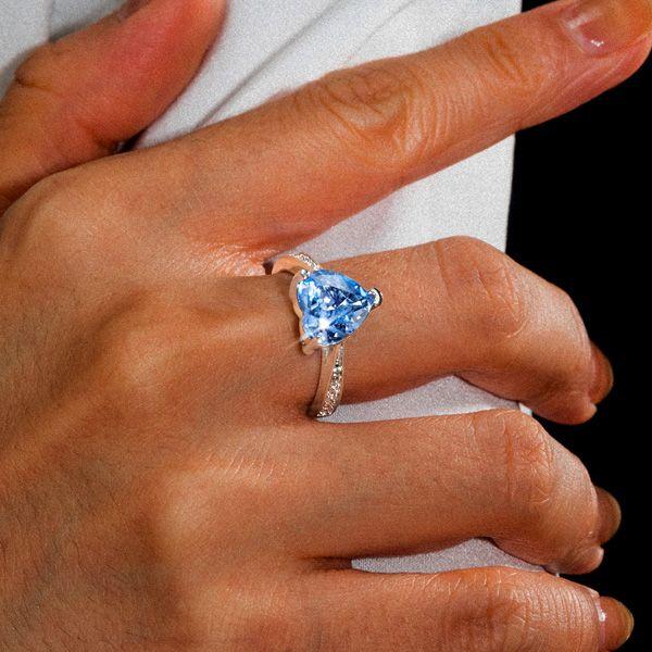 Heart Design Blue Topaz Engagement Ring in Rhodium Plated Sterling Silver