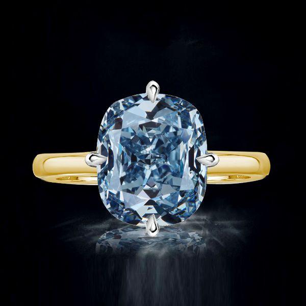 Blue Topaz Cushion Cut Solitaire Engagement Ring in Sterling Silver