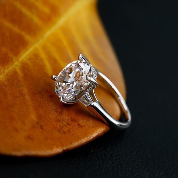 Oval Created White Sapphire Three Stone Engagement Ring in Sterling Silver