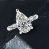 Pear Cut Created White Sapphire Eternity Engagement Ring in Sterling Silver