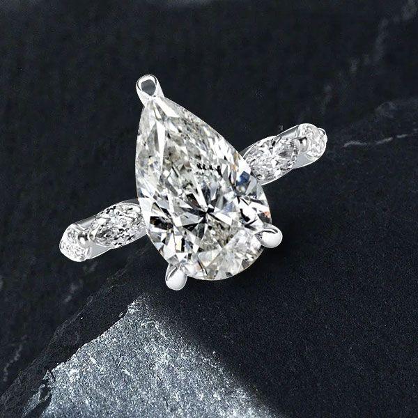 Pear Cut Created White Sapphire Eternity Engagement Ring in Sterling Silver