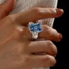 Three Stone Blue Topaz Emerald Cut Engagement Ring in Sterling Silver