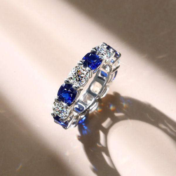 White & Blue Sapphire Cushion Cut Sterling Silver Eternity Band