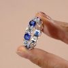 White & Blue Sapphire Cushion Cut Sterling Silver Eternity Band