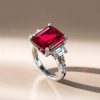 Emerald Cut Three Stone Engagement Ring in Rhodium Plated Sterling Silver
