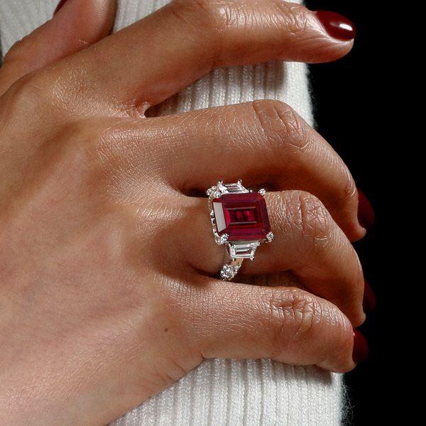 Emerald Cut Three Stone Engagement Ring in Rhodium Plated Sterling Silver