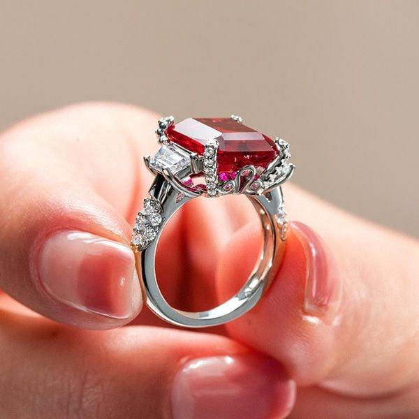 Emerald Cut Three Stone Engagement Ring in Rhodium Plated Sterling Silver