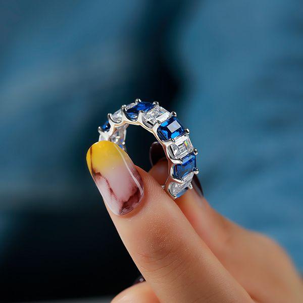 Eternity Emerald Cut Blue & White Simulated Diamond Wedding Band in Sterling Silver