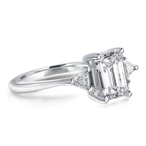 Emerald Cut Three Stone Engagement Ring in Rhodium Plated Sterling Silver