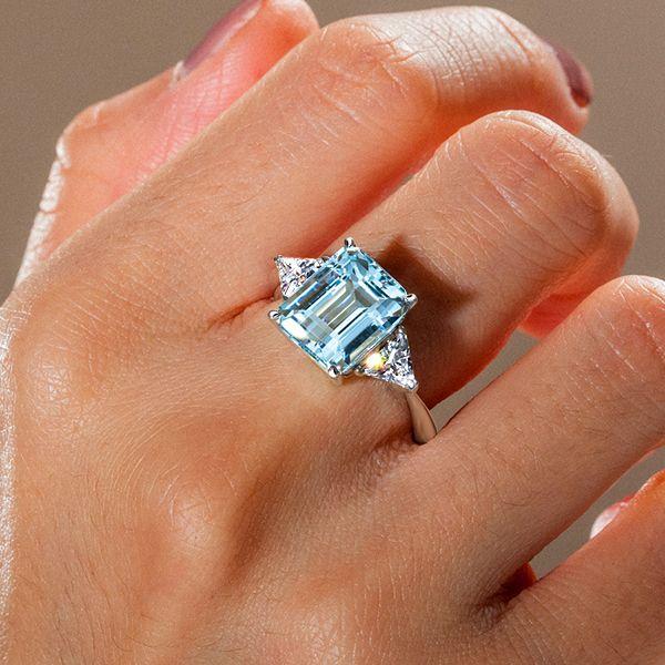 Emerald Cut Aquamarine Three Stone Engagement Ring in Sterling Silver