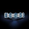 Oval Cut Blue Topaz Eternity Wedding Band in Rhodium Plated 925 Sterling Silver