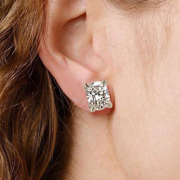 Oval Cut White Sapphire Stud Earrings in Rhodium Plated Sterling Silver