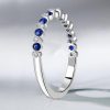 Sterling Silver Alternating White and Blue Sapphire Bezel Wedding Band (0.32 CT. TW.)