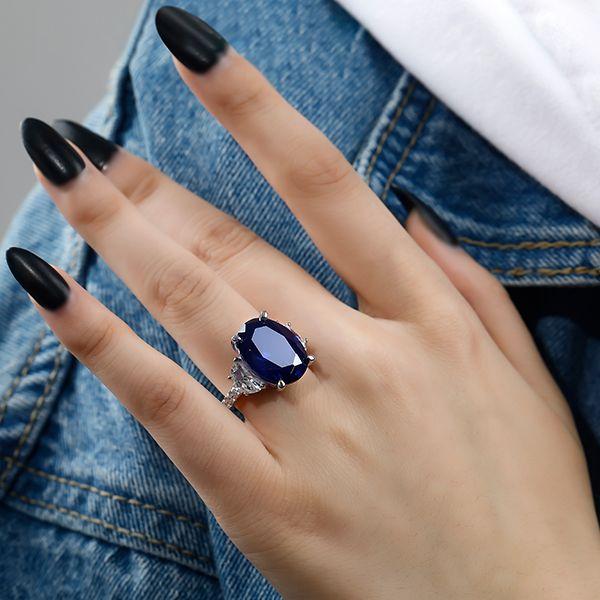 Oval Created Sapphire Three Stone Engagement Ring in Sterling Silver