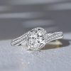 Bypass Oval Cut Engagement Ring with 1.47 CT. TW. Simulated Stones in Rhodium-Plated Sterling Silver