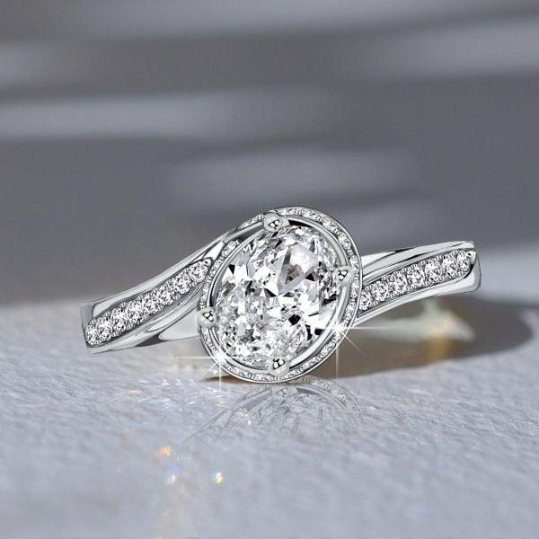 Bypass Oval Cut Engagement Ring with 1.47 CT. TW. Simulated Stones in Rhodium-Plated Sterling Silver