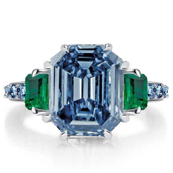 Genuine Blue Topaz 3 Stone Engagement Ring in Rhodium Plated Sterling Silver