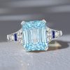Art Deco Emerald Cut Aquamarine Engagement Ring in Rhodium Plated Sterling Silver