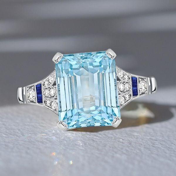 Art Deco Emerald Cut Aquamarine Engagement Ring in Rhodium Plated Sterling Silver