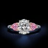 4.00 CT. TW. Three Stone Oval and Heart Cut White Sapphire Engagement Ring in Rhodium Plated Sterling Silver