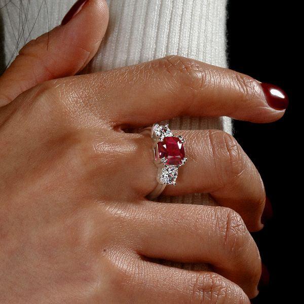 Three Stone Cushion Cut Ruby Engagement Ring in Rhodium-Plated Sterling Silver