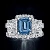 Emerald Cut Blue Topaz Bridal Ring Set in Rhodium Plated 925 Sterling Silver