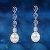 Dangle Earrings with Blue Topaz and Pearl Drops in Rhodium Plated Sterling Silver