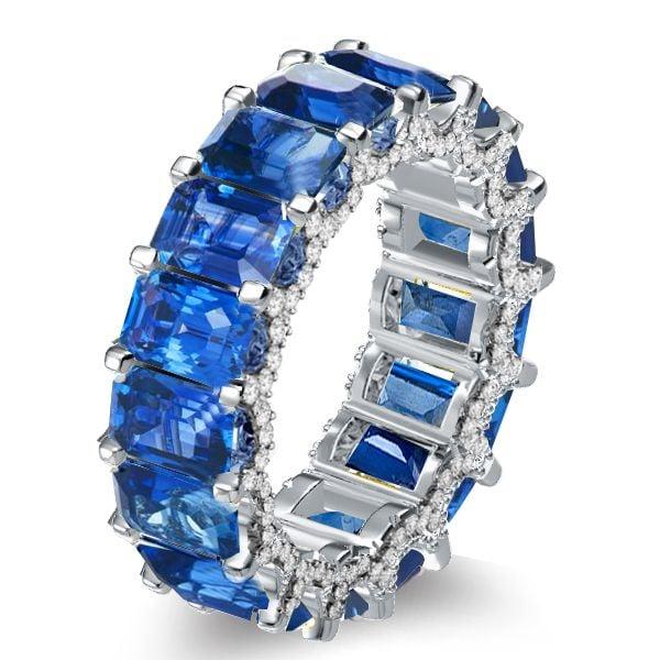 Emerald Cut Blue Topaz Eternity Band Ring in Rhodium-Plated Sterling Silver
