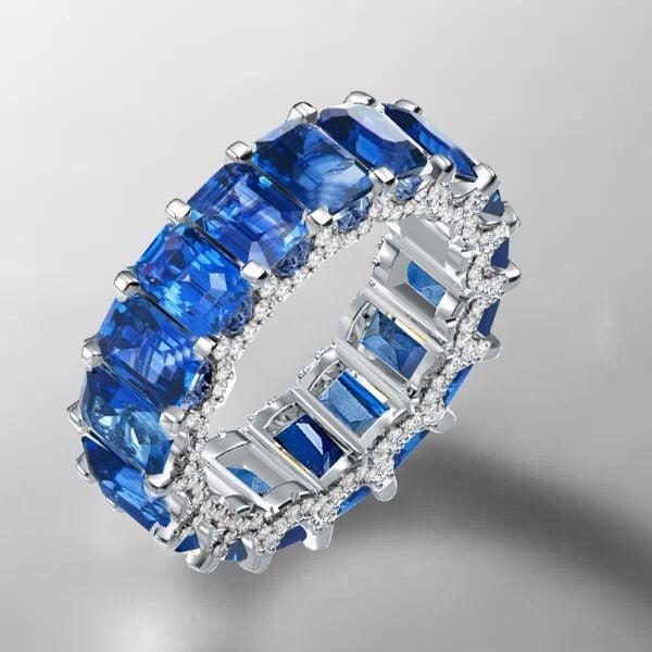 Emerald Cut Blue Topaz Eternity Band Ring in Rhodium-Plated Sterling Silver