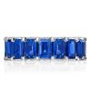Emerald Cut Blue Topaz Eternity Band Ring in Rhodium-Plated Sterling Silver