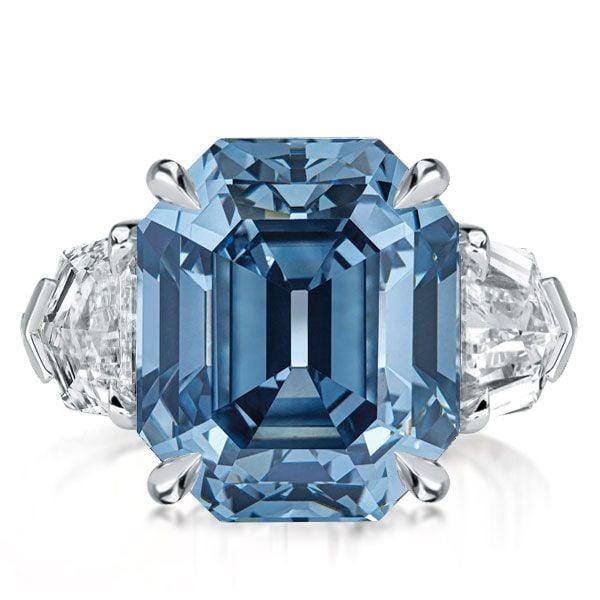 Three Stone Emerald Cut Blue Topaz Engagement Ring in Rhodium Plated Sterling Silver