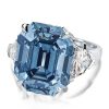 Three Stone Emerald Cut Blue Topaz Engagement Ring in Rhodium Plated Sterling Silver