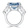 Three Stone Emerald Cut Blue Topaz Engagement Ring in Rhodium Plated Sterling Silver