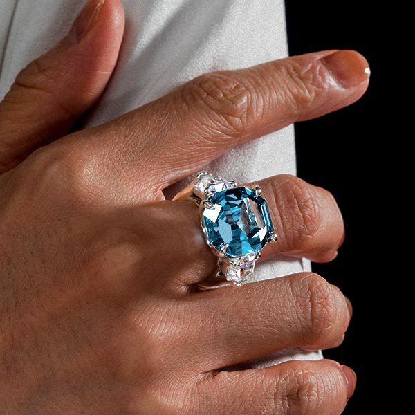 Three Stone Emerald Cut Blue Topaz Engagement Ring in Rhodium Plated Sterling Silver