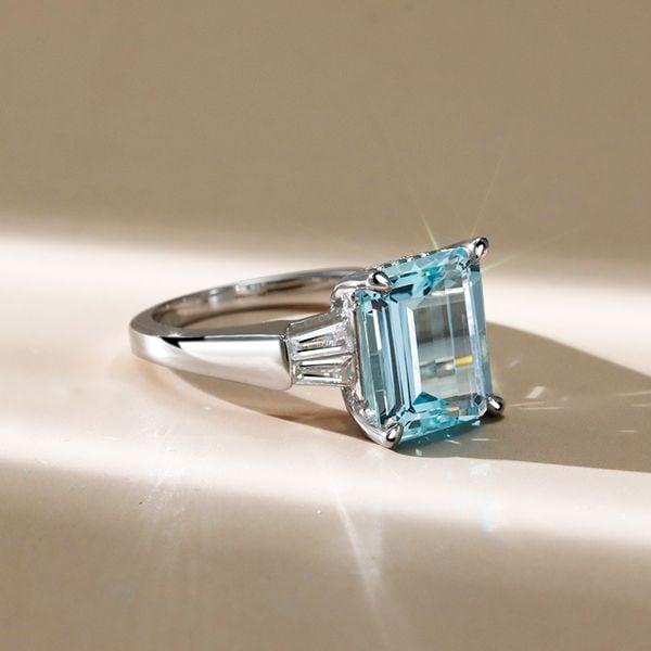 Three Stone Emerald Cut Aquamarine Engagement Ring in Rhodium-Plated Sterling Silver