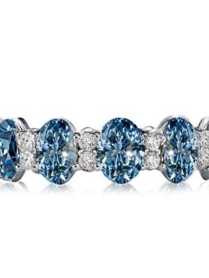 Oval Blue Topaz Eternity Wedding Band in Sterling Silver
