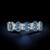 Oval Blue Topaz Eternity Wedding Band in Sterling Silver