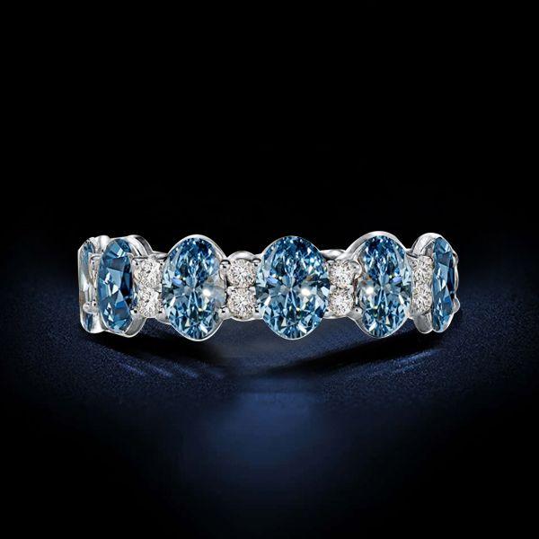 Oval Blue Topaz Eternity Wedding Band in Sterling Silver