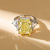 Three Stone Radiant Cut Yellow Topaz Engagement Ring in Rhodium Plated Sterling Silver
