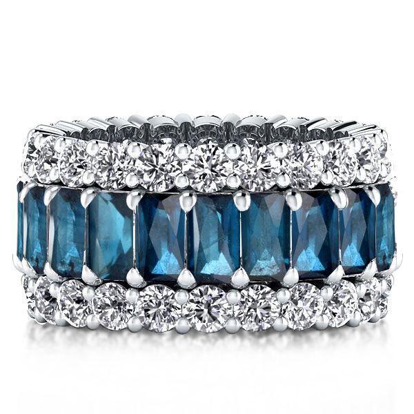 Emerald Cut Created Blue Topaz Eternity Wedding Band in Sterling Silver