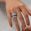 Emerald Cut Created Blue Topaz Eternity Wedding Band in Sterling Silver