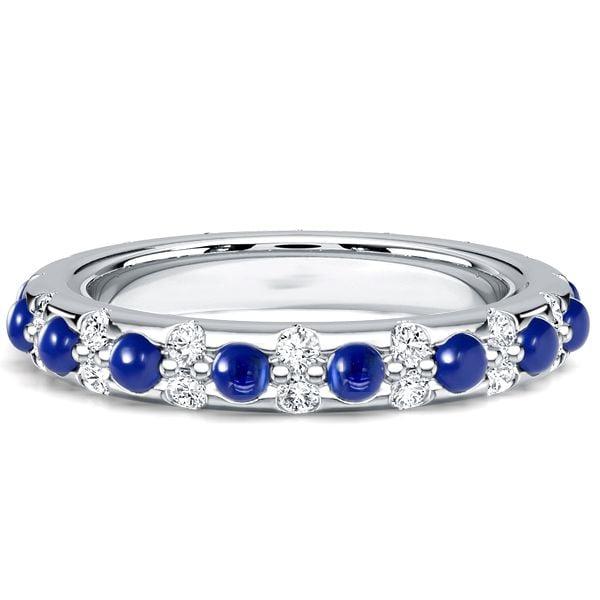 Round Cut White and Blue Sapphire Eternity Band Ring in Rhodium Plated Sterling Silver