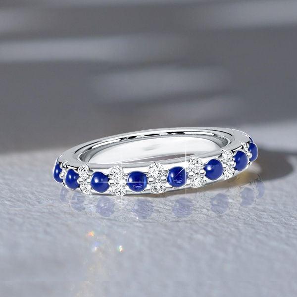 Round Cut White and Blue Sapphire Eternity Band Ring in Rhodium Plated Sterling Silver