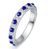 Round Cut White and Blue Sapphire Eternity Band Ring in Rhodium Plated Sterling Silver