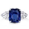 10.99 CTW Radiant and Pear Cut Blue Sapphire Engagement Ring in Rhodium Plated Sterling Silver