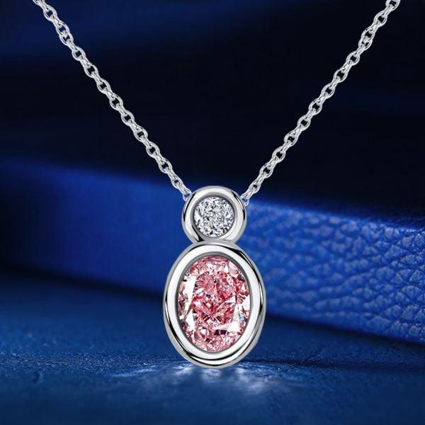 Oval Cut Pink Sapphire Bezel Set Pendant Necklace in Sterling Silver