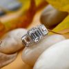 Emerald Cut Three Stone Halo Engagement Ring in Sterling Silver with Created White Sapphire